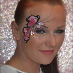 Kiss My Fairy chunky glitter eye and butterfly face paint design