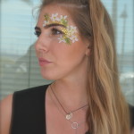 Kiss My Fairy chunky glitter eye and flower face paint design