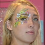 Kiss My Fairy chunky glitter eye and flower face paint design