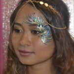 Kiss My Fairy chunky glitter eye and feather face paint design